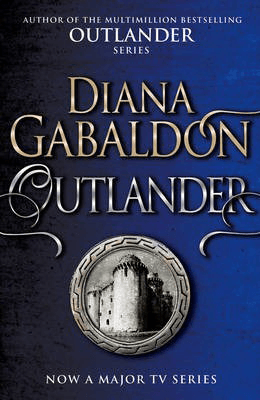 Outlander Series Diane Gabaldon book cover with old building on blue background