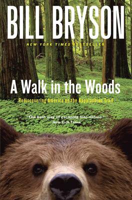 A Walk In The Woods By Bill Bryson book cover with brown bear in woods