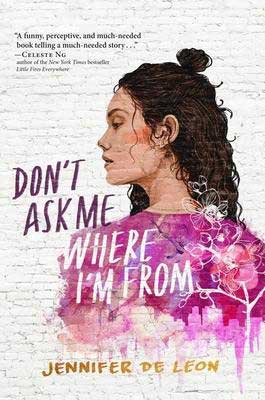 Don't Ask Me Where I'm From by Jennifer De Leon book cover with young woman with curly brown hair wearing a pink shirt made of flowers and trees